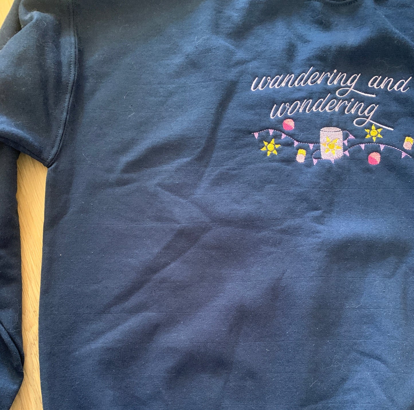 Second - Large - Navy Sweatshirt with 'Wandering Sun' Design